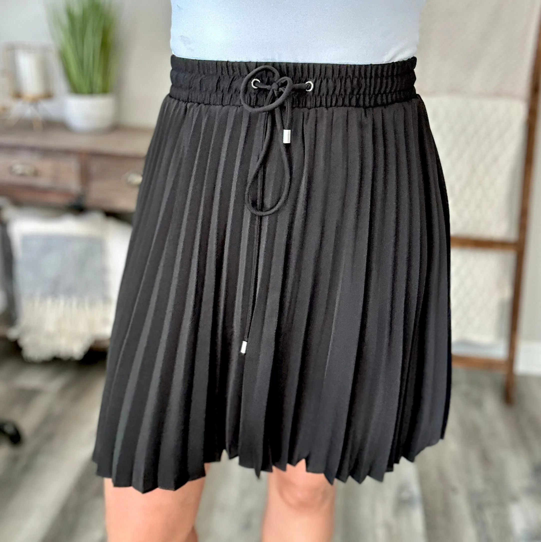 Just a Flirt Pleated Skirt in Black